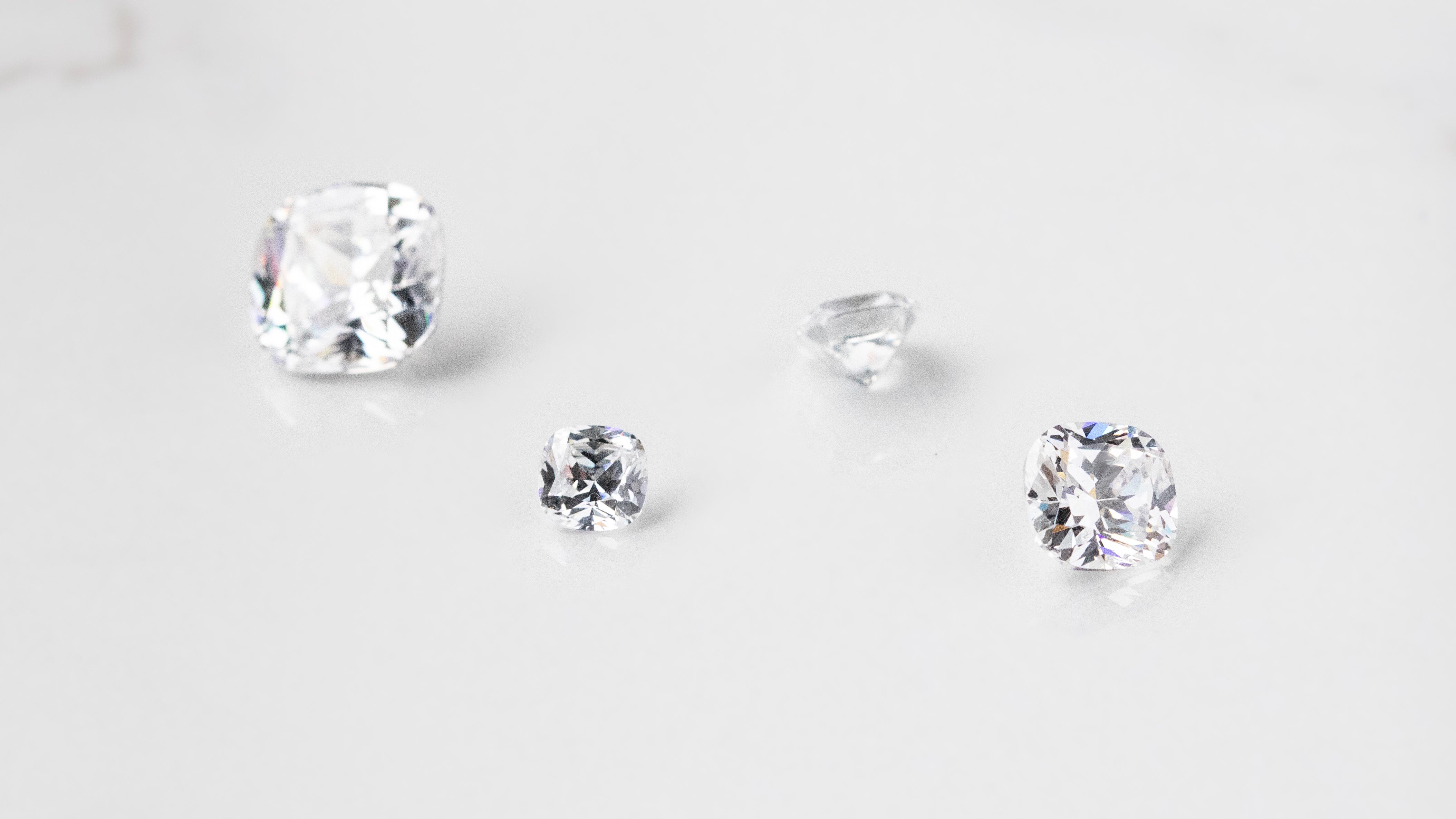 Four loose Nexus Diamond alternatives