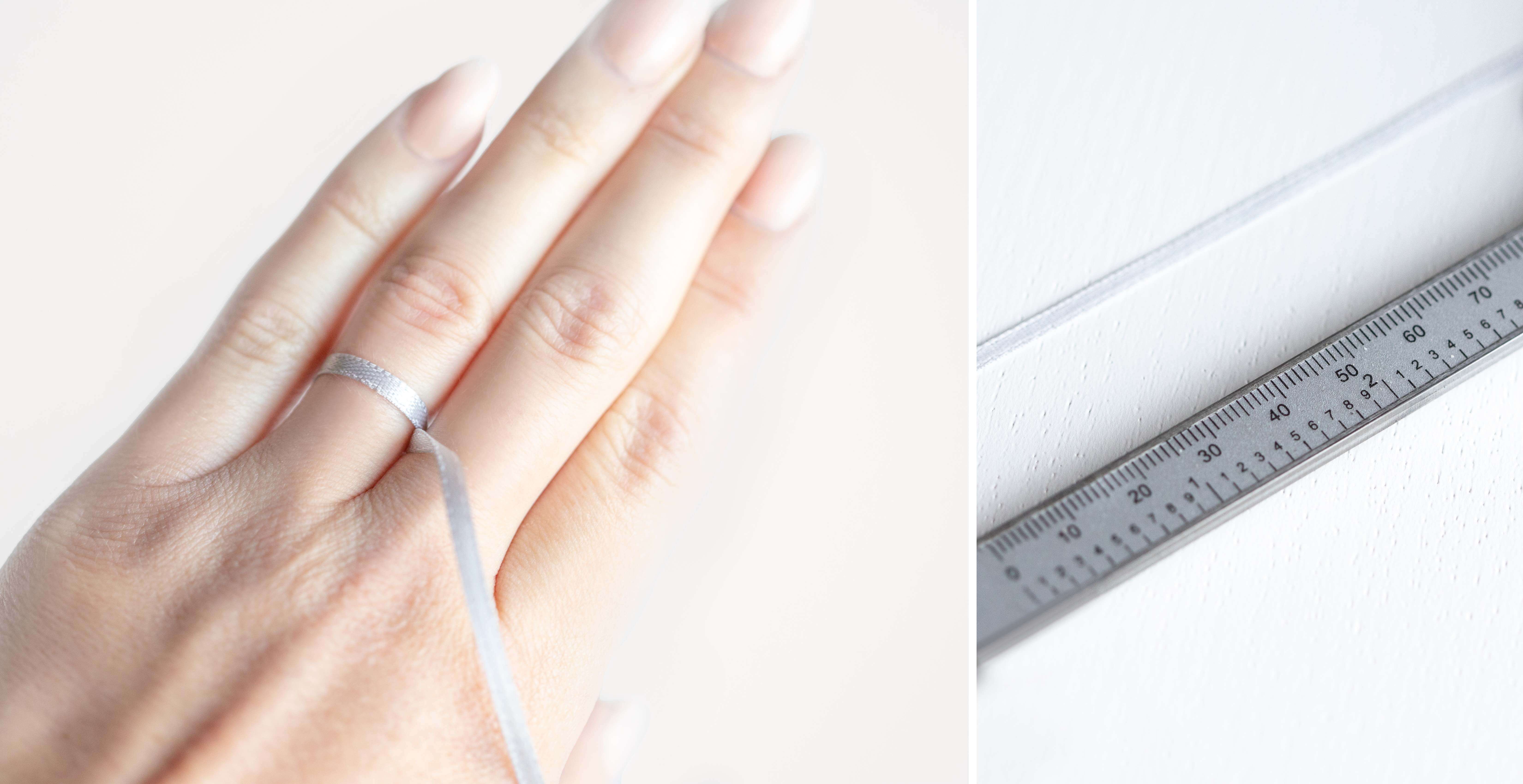 A piece of fabric wrapped around a finger to measure ring size. 