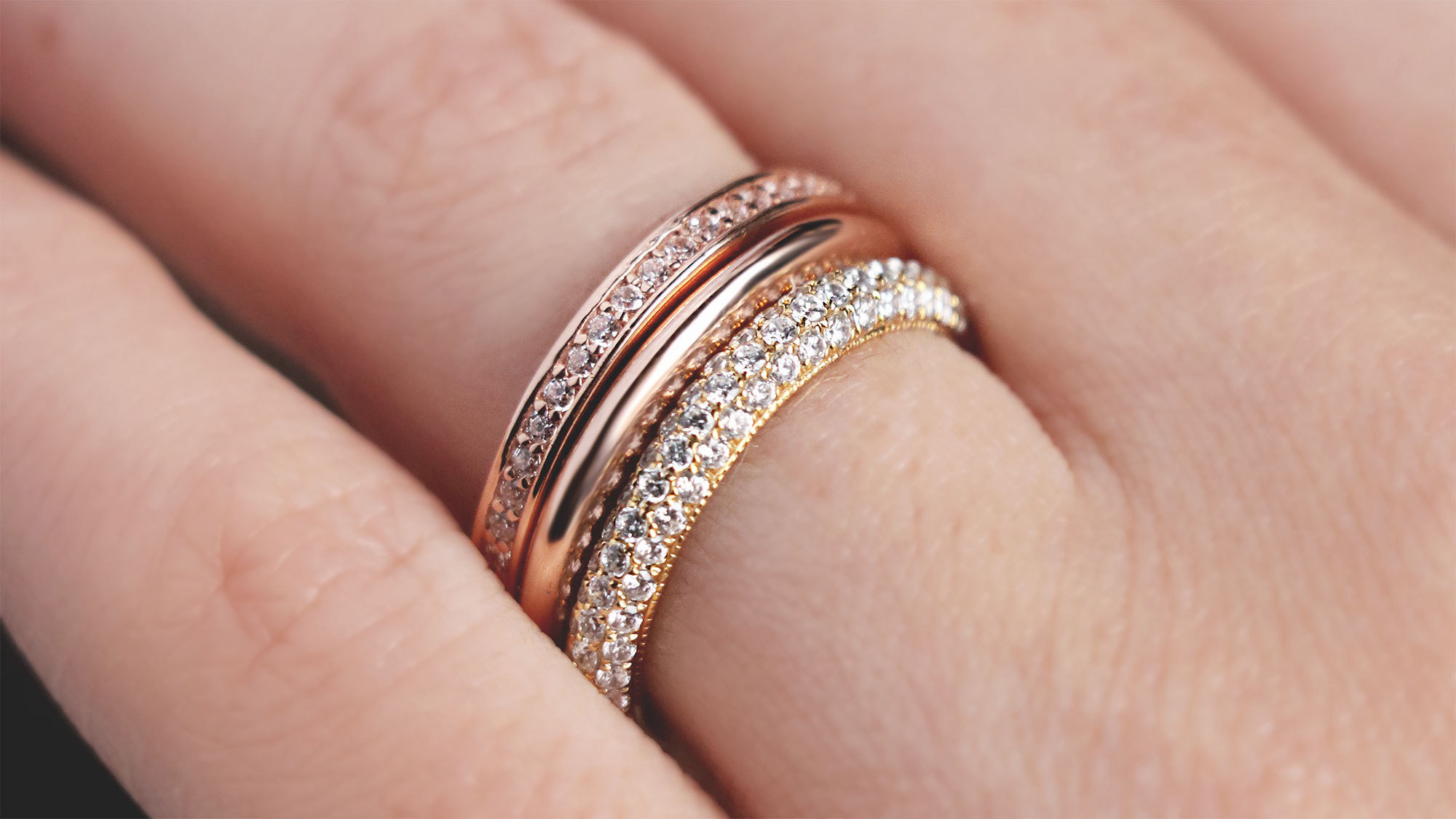 A mixed-metal ring stack featuring accented and classic styles.