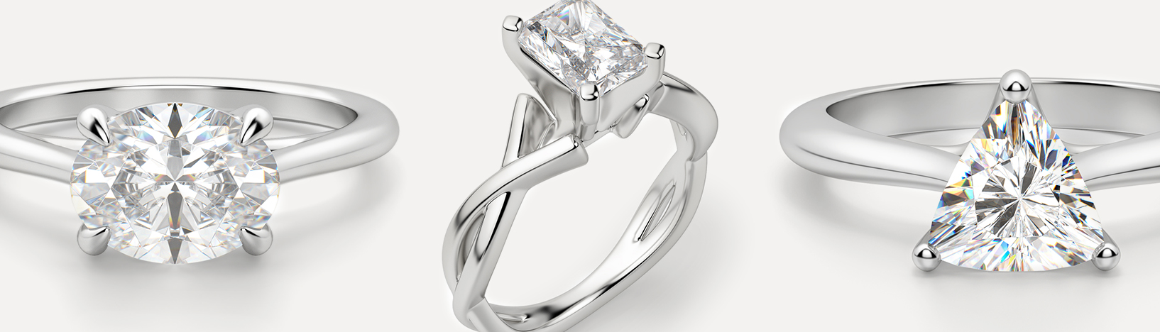 Simulated diamond engagement rings featuring different design elements.