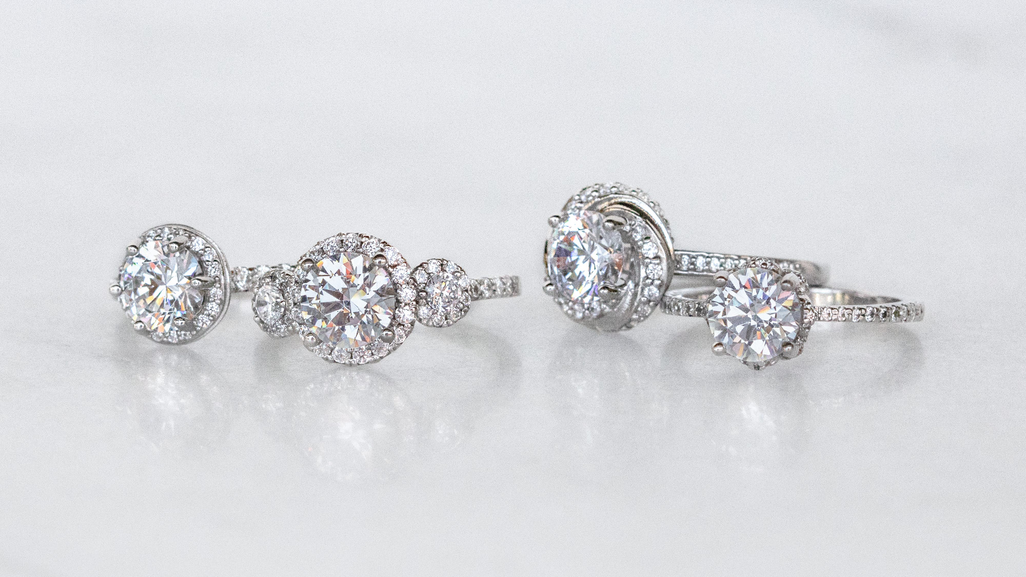 four different halo cut engagement ring options