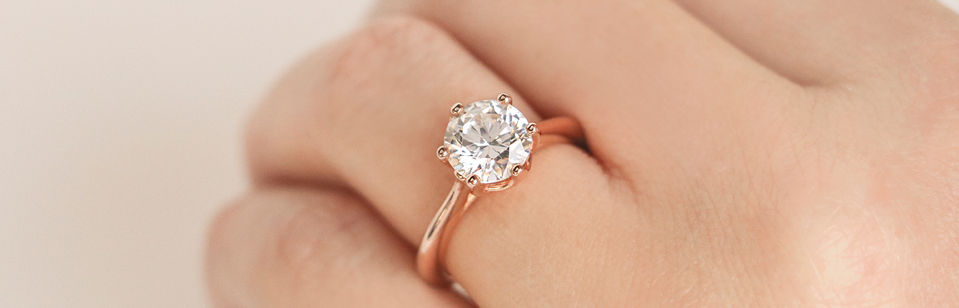 A rose gold solitaire engagement ring from Diamond Nexus

