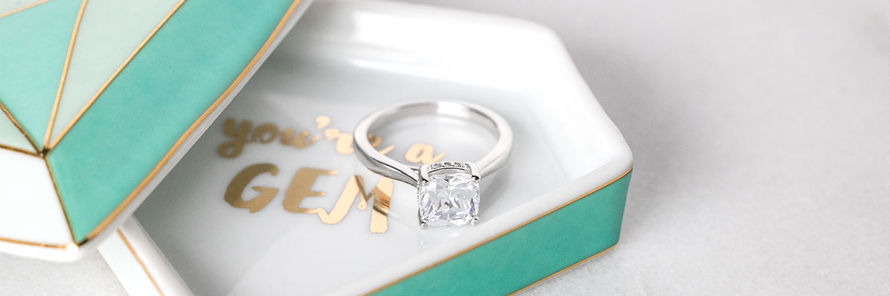 A Diamond Nexus engagement ring in a ring dish.
