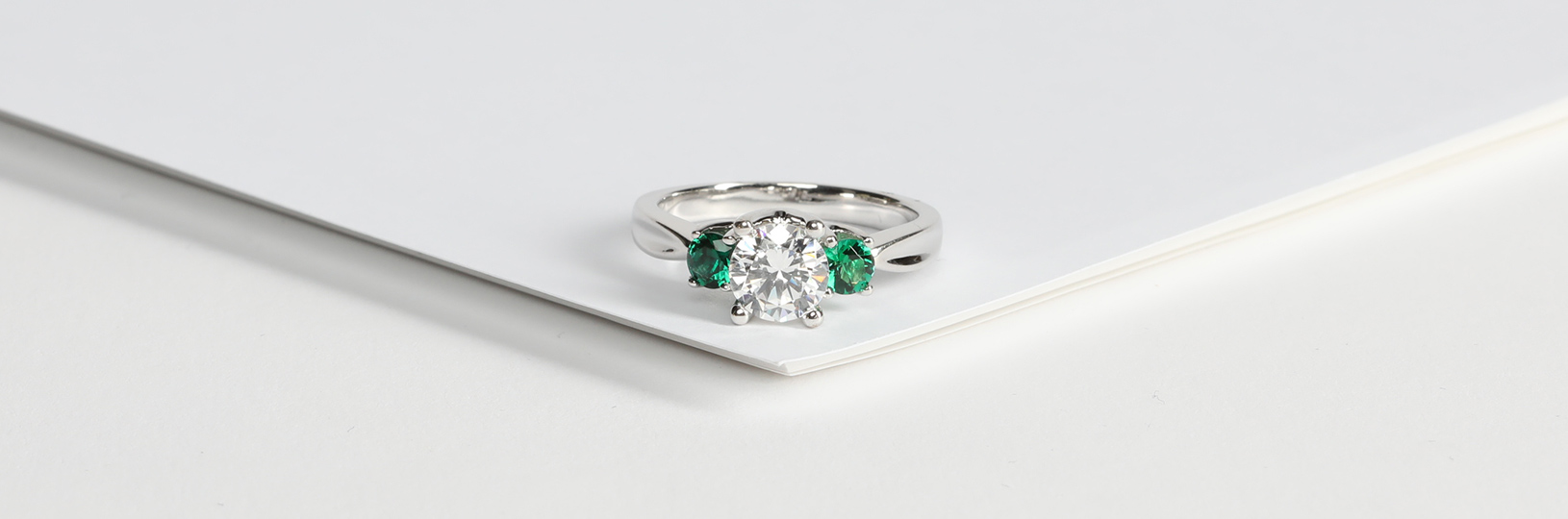 A lab created emerald engagement ring.