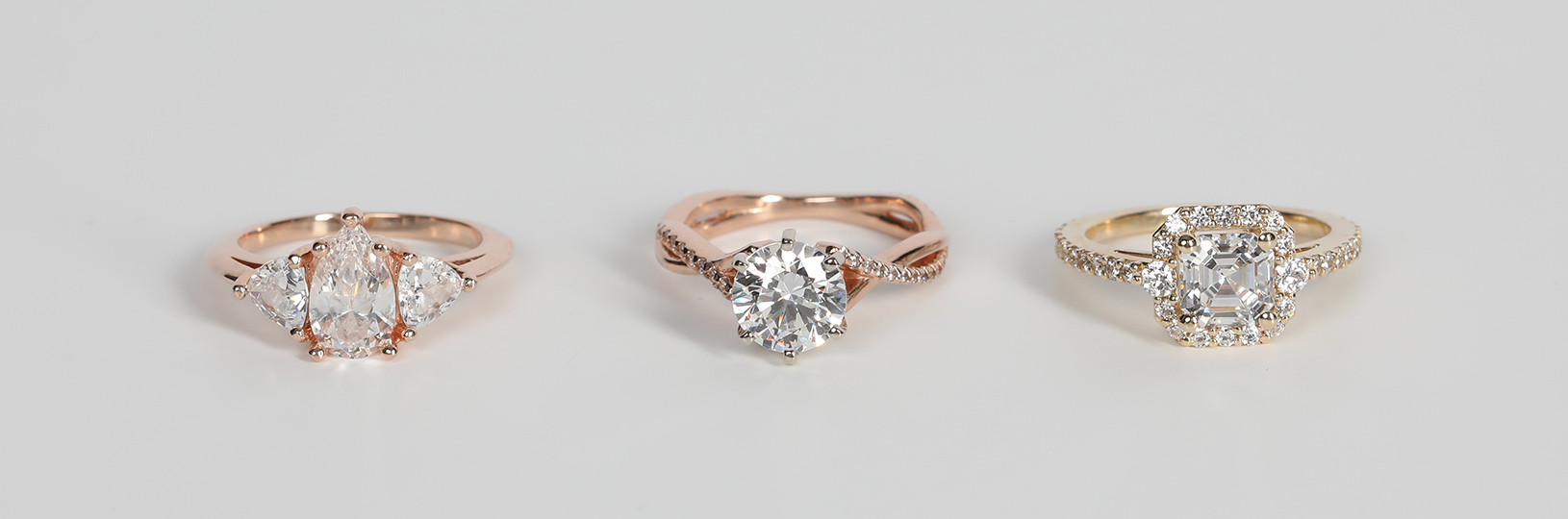 Affordable engagement rings set with lab created diamond simulants.