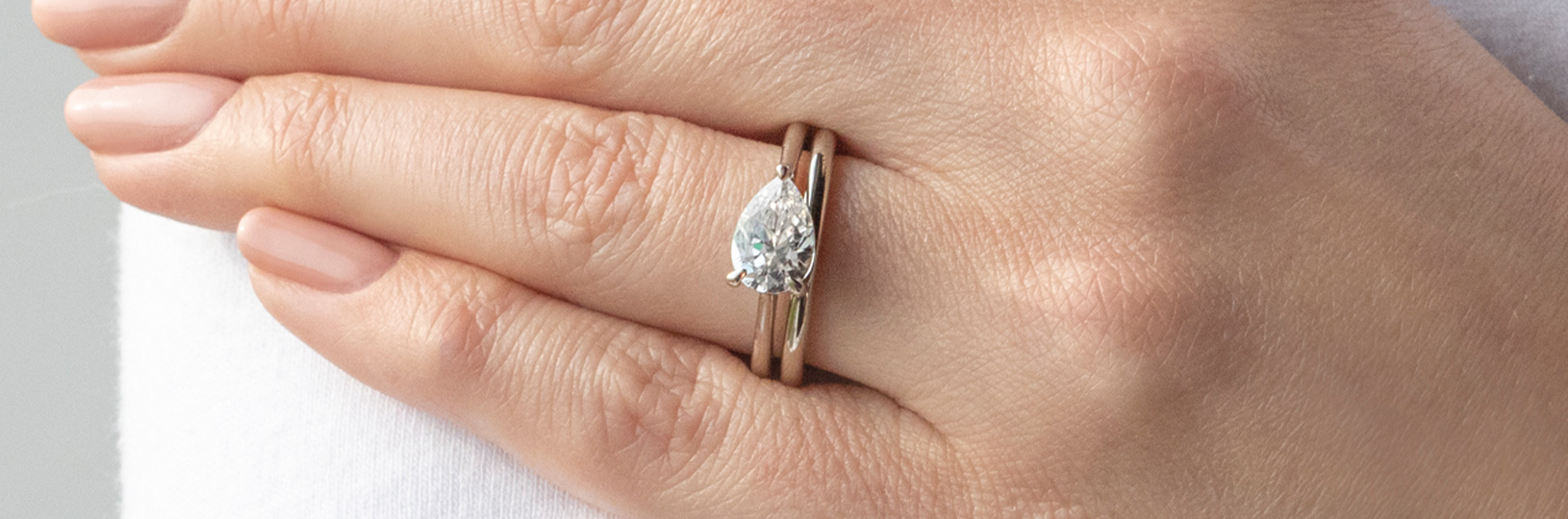 East-west solitaire engagement ring set.