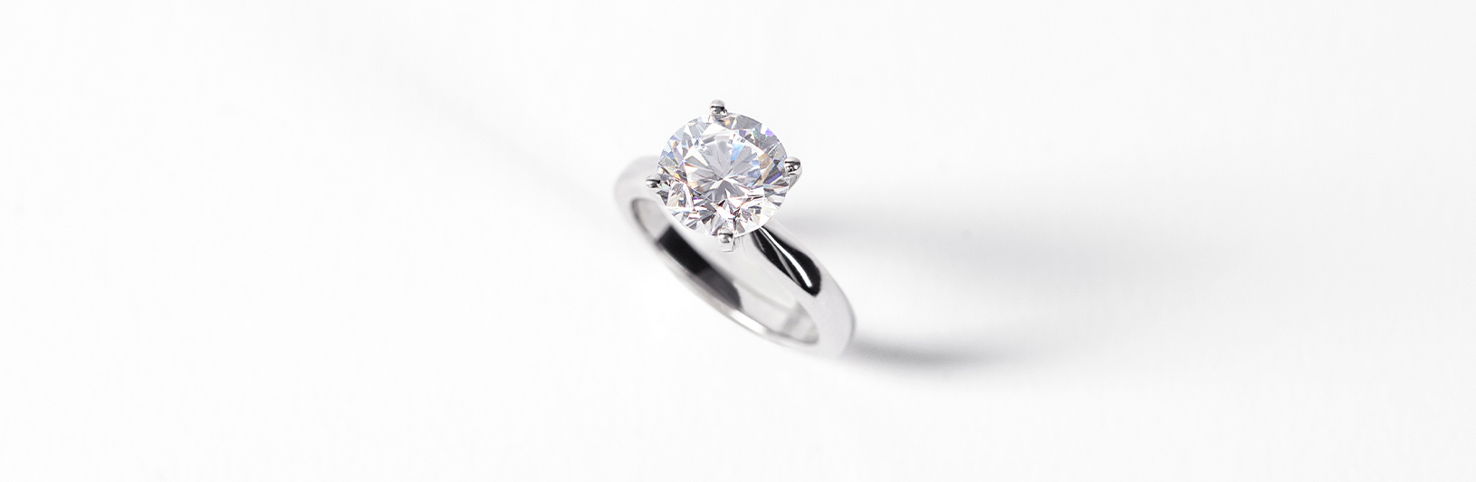 A solitaire engagement ring with a round cut Nexus Diamond™ alternative