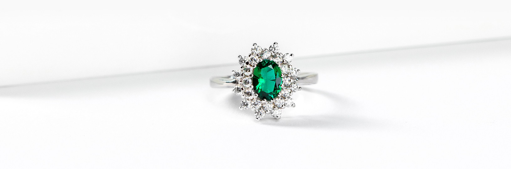 Halo emerald engagement ring