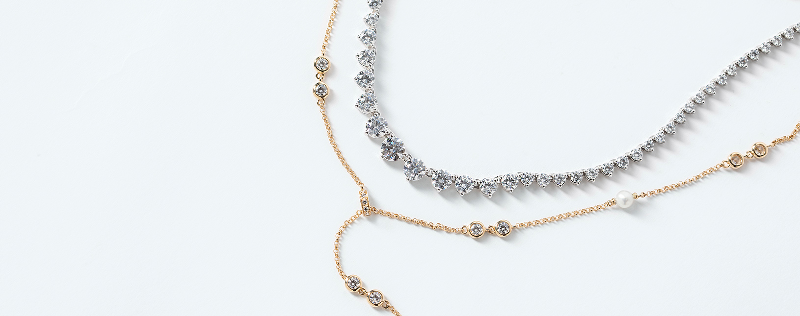 Two necklaces featuring lab grown diamond alternatives