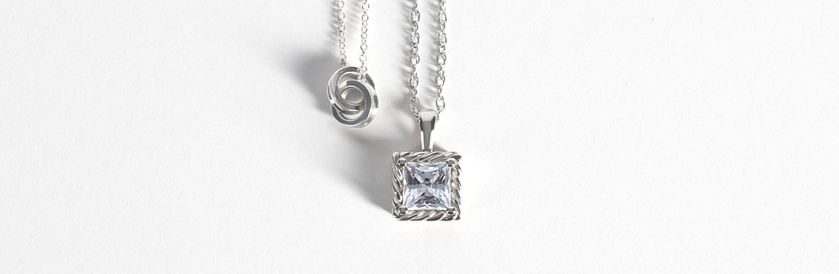A princess cut simulated diamond pendant