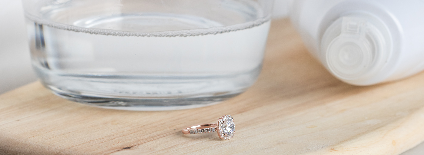 A rose gold engagement ring after being soaked in warm water