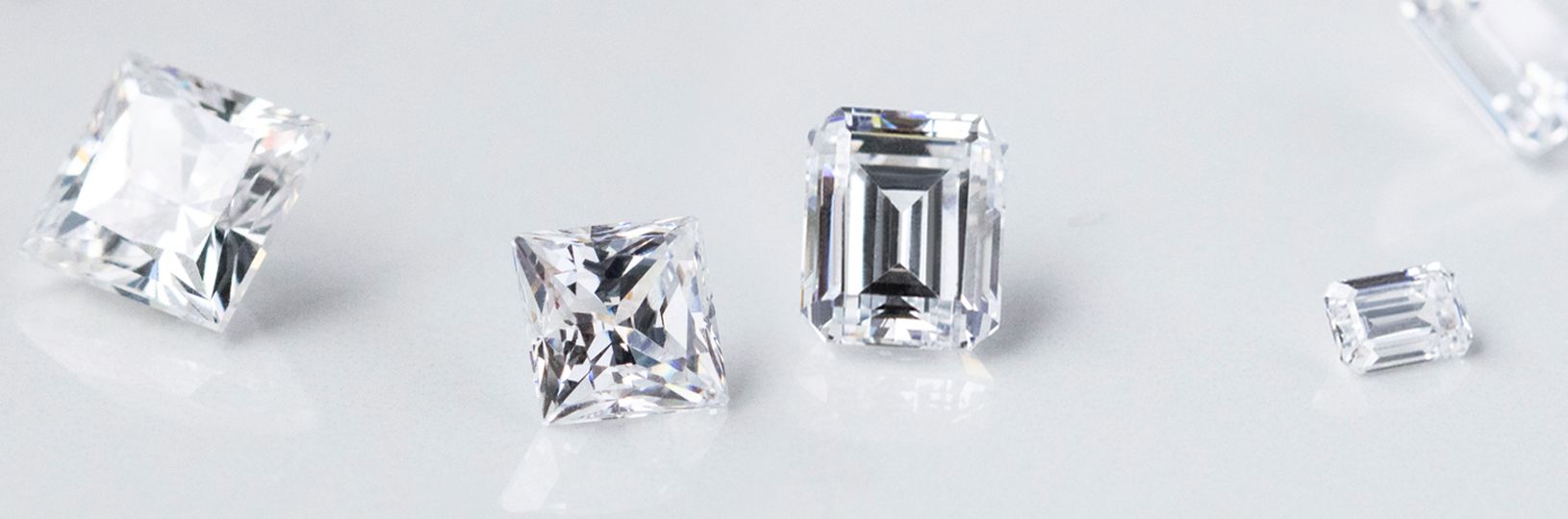 Several loose diamond simulants in different cuts and sizes