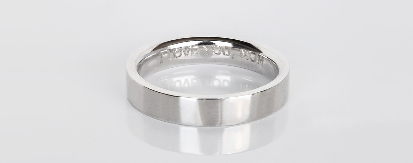 A silver ring with engraving