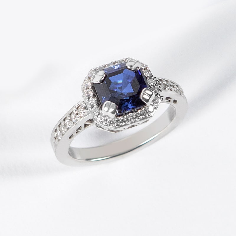 A sapphire stone in a halo setting