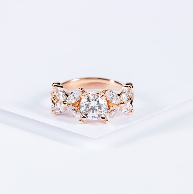 Rose gold engagement ring with marquise accent stones