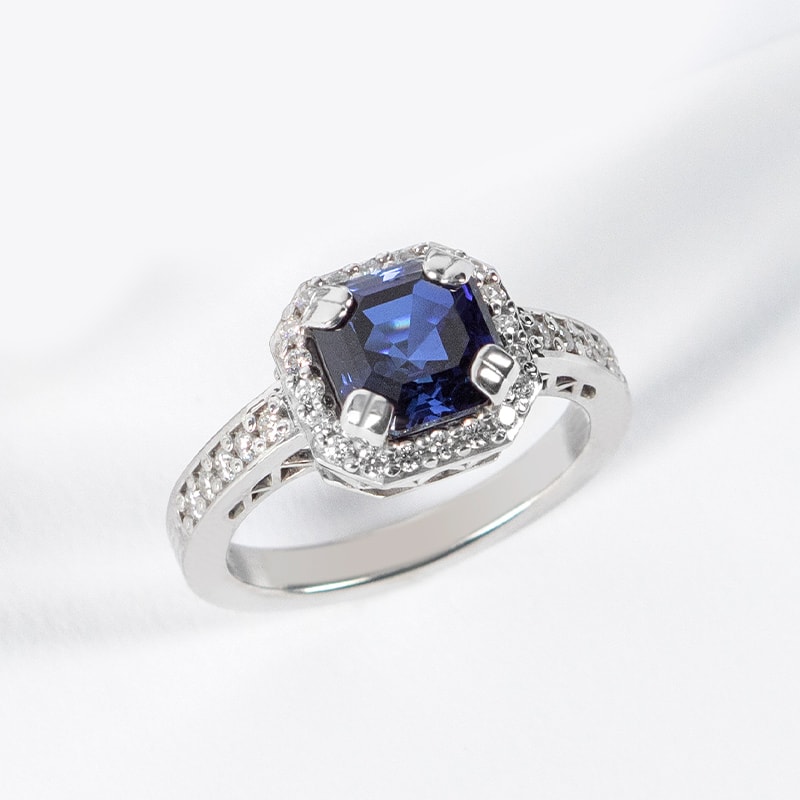 A vintage engagement ring featuring a blue sapphire stone