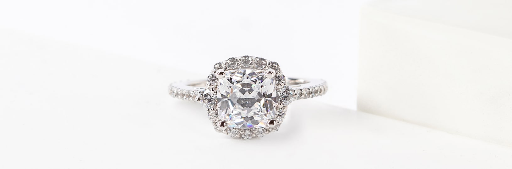 A halo engagement ring in a white gold setting