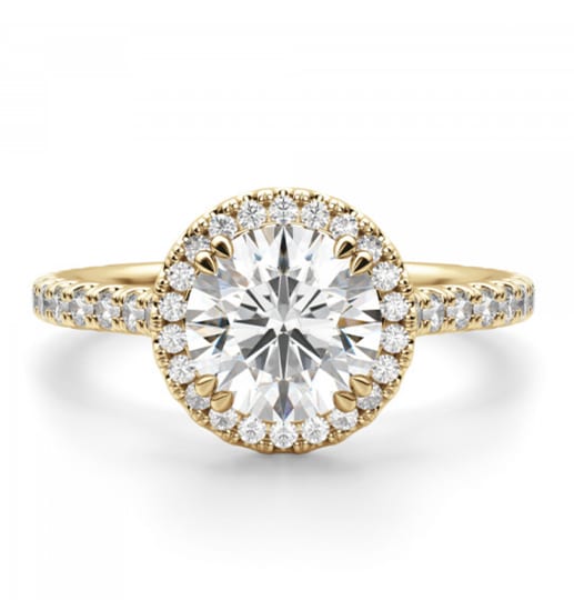 A round cut stone in a halo engagement ring setting