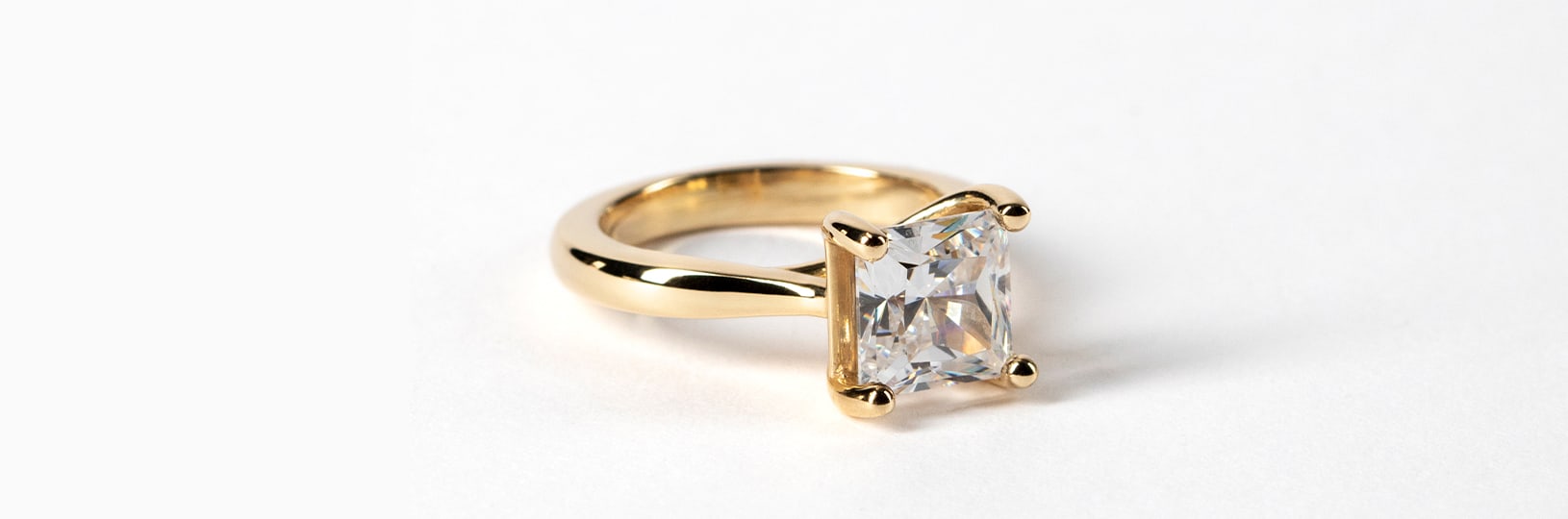 A yellow gold engagement ring