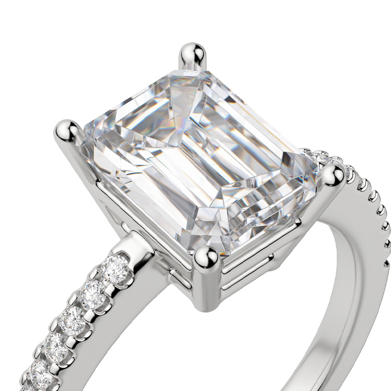 An emerald cut ring with an accented band