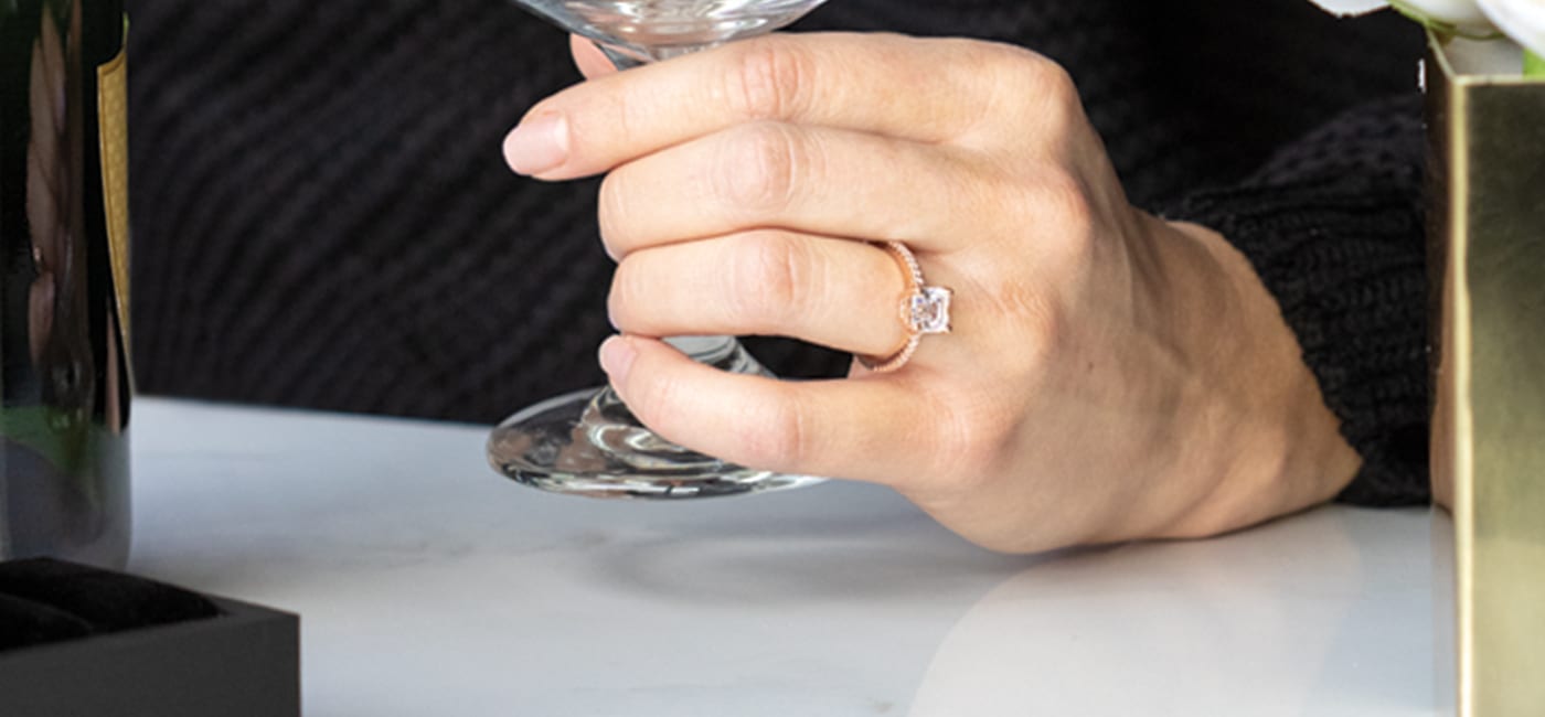 A Diamond Nexus engagement ring featured on a hand.