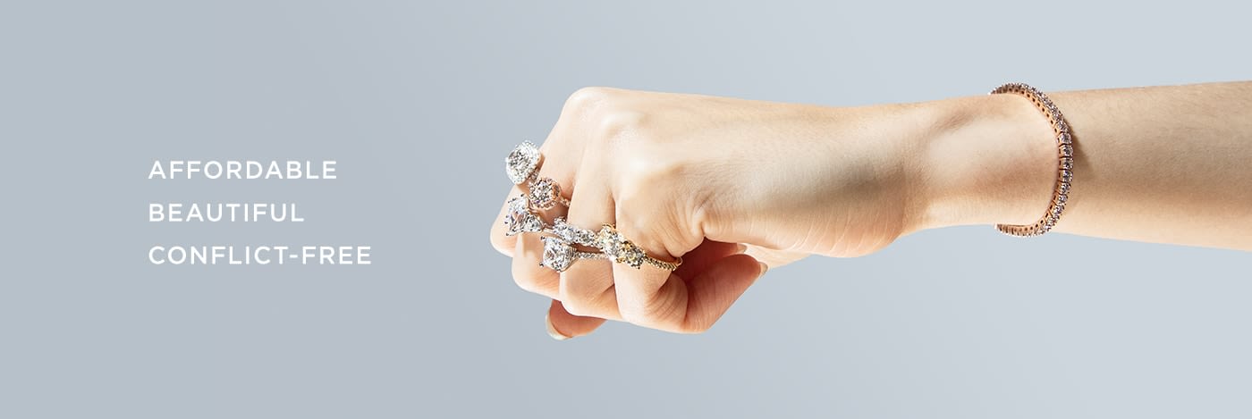 A fist wearing affordable, beautiful and conflict-free engagement rings set with Nexus Diamond alternatives.