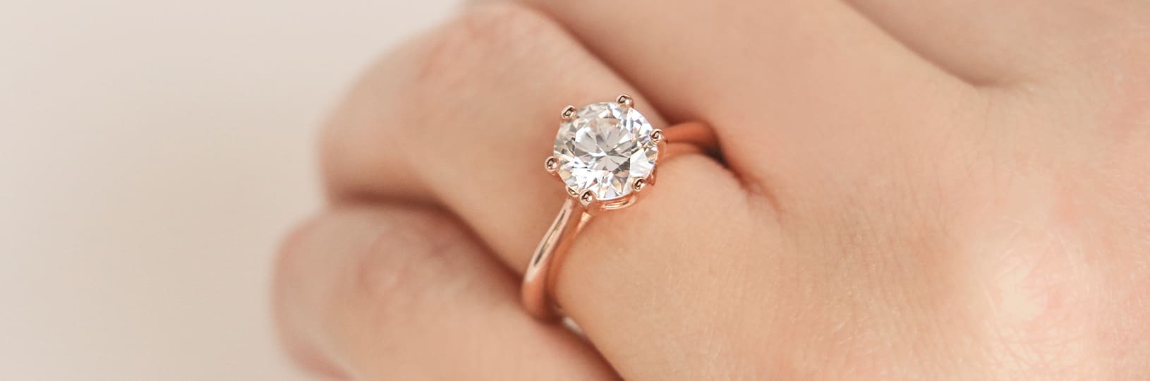A solitaire lab created diamond simulant engagement ring.