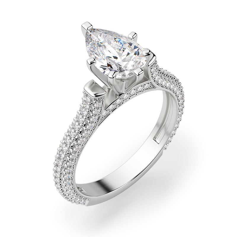 An emerald cut stone in a solitaire engagement ring setting