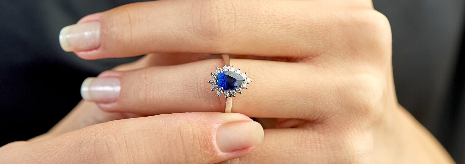 A sapphire birthstone ring in a halo setting
